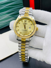 Rolex oyster perpetual two tone with Golden dial and date