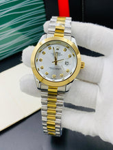 Rolex oyster perpetual two tone with White dial and date