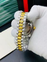 Rolex oyster perpetual two tone with White dial and date